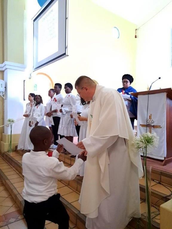 First Holly Communion - receiving the certificate